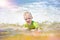 Little boy swimming in the sea, running and splashing in the waves of pure.