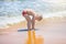 Little boy swimming in the sea, running and splashing in the waves of pure.