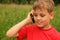 Little boy talking on cell phone outdoors