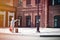 Little boy with teddy bear toy and suitcase shows forward