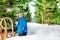 Little boy throw snowball in park