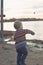 Little Boy Throwing Rock into the Lake