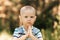 Little boy todler in nature in the summer. Portrait