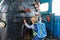 Little boy tourist considers controls Old black steam locomotive in Russia, Moscow railway station