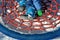 Little boy trains stability at the children`s rope center, playground for schoolchildren. A very torn net must be repaired or repl