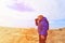 Little boy travel looking at binoculars in Bardenas Reales nationa park