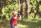 Little boy travel in nature looking through binoculars