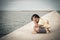 Little boy unhappy sitting alone on bridge