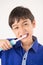 Little boy using electric toothbrushes dental healthcare on white background