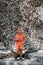 A little boy is walking in the park. A child with his parents explores local attractions, garden figures and sculptures.