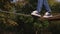 A little boy walking on a tightrope in a rope Park, close-up of his feet.