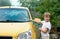 Little boy washing car