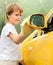 Little boy washing car.