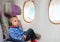 Little boy watching television in flight