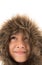 Little boy wearing fur coat protect from cold snow over head