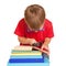 Little boy wearing glasses reading a book