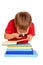 Little boy wearing glasses reading a book with a magnifying glass