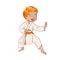 Little boy wearing kimono practicing karate