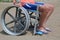 Little boy on the wheelchair on the beach
