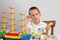 Little boy - woodcraft ship painting, thinking