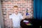 Little boy working with microscope for studying microbes