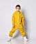 Little boy in yellow fleece sportswear posing for camera