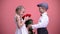 Little boyfriend giving bouquet of roses to young female, Valentines day, love