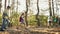 Little boys and girls, children, friends walking in forest on warm autumn day. Active outdoor walk