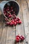 Little brass bucket of cherries on a table