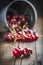 Little brass bucket of cherries on a table