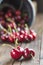 Little brass bucket of cherries on a table