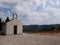 Little brick chapel in mountains in Croatia in cloudy day
