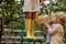 Little brothers help older sister collect lemons