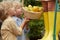 Little brothers help older sister collect lemons