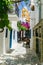 Little cafe in a paved road in Driopis Driopida, the traditional village of cycladic island Kythnos in Greece