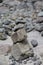 little cairn, stacked stones on a stone field, detail of landscape