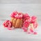 Little cake, pie on wooden white kitchen plate with spring flowers tulips and roses