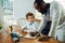 Little caucasian boy as a doctor consulting for patient, working in cabinet, close up