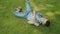 Little caucasian boy rolling on the grass, laughing joy, smile, childhood, park, leisure, fooling around
