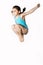 Little caucasian female 7 years old girl in cyan swimming costume jumping on white background.