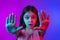 Little caucasian girl`s portrait isolated on gradient pink-blue background in neon light.