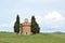 Little chapel surrounded by cypress trees