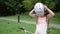 Little charming girl child puts on a bicycle helmet for cycling