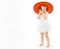 Little cheerful girl child in a red hat