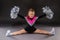 A little cheerleader girl does the splits
