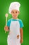 Little chef showing wooden spoon