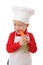 Little chief-cook tasting the carrot