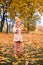 Little Child Baby Girl Caucasian Walking in Park with Leaf Autumn