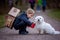 Little child, blond boy with pet dog, carying home on his back, kid, having paper house