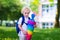 Little child with candy cone on first school day